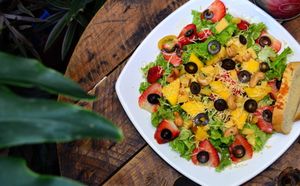 Ensalada Tropical with Strawberries, Mango, Black Olives and Cashew Nuts at Naturalia Cafe in Medellin