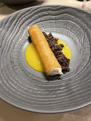 Phyllo pasta cannolo with coconut and mango at Il Papeoto in La Spezia