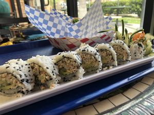 Uramaki Roll at Sea Ranger Seafood Station in Ventura !!! Loaded with “Ahi & crab” cucumbers, carrots, avocado, Daikon root, and drizzled with “eel” sauce and wasabi mayo  at Seed Ranger in Ventura