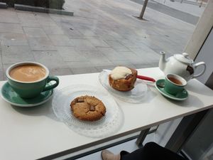 Latte with chocolate chip cookie and cinnamon bun with tea at Tori's Bakeshop - Canary District in Toronto