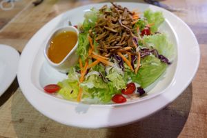 Salad With Orange Ginger Sauce. at Vegan Delights Cafe in Ipoh