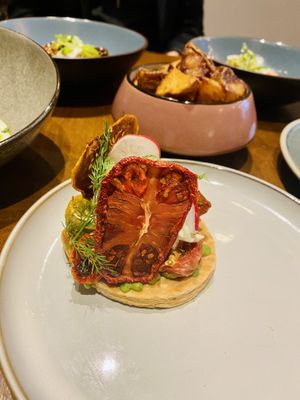 Heritage Tomato Tart 
A beautifully fresh, summer tart with confit heritage tomatoes, whipped garlic gorgonzola, fresh English radish, tarragon, dill & tomato crisps.  at No. Twelve in Nottingham