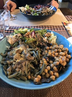 Buddha bowl with spirulina pasta, chickpeas and mushrooms and salad  at El Brot in Alp