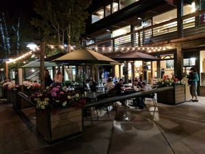 Outdoor seating area at night  at The Stew Pot in Snowmass Village