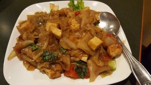 Pad Kee Mow - aka Drunken Noodle, made with thick rice noodle pan fried with tofu, tomato, Thai basil, spicy chopped fresh chilies, and soy sauce. at Thai Basil in Cameron Park