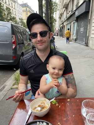 My husband and daughter enjoying their meal! We sat out front.  at Bodhi Vegan in Paris