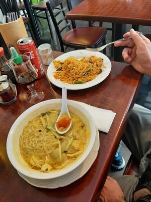 Curry noodle soup and another spicy noodle dish at Bodhi Vegan in Paris