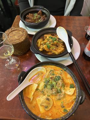 Caramelized chicken, prawns with tofu and pineapple, beef coconut noodle soup with peanuts (must try!!) and sticky rice   at Bodhi Vegan in Paris