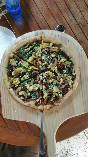 Mediterranean pizza with vegan parmezan  at The Lovin Oven at Ailovenalo in Honolulu