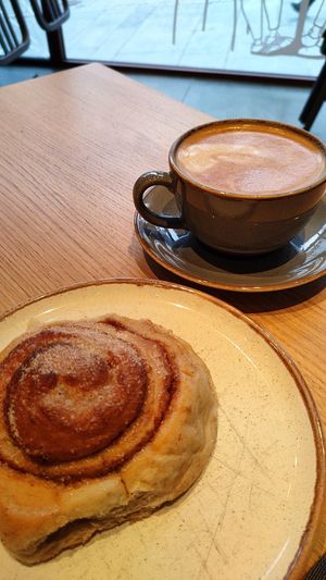 Amazing vegan cinnamon bun and oat milk cappuccino. at Godt Brød Fløyen in Bergen