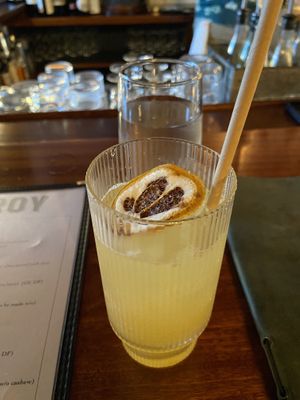 Pineapple and star anise mocktail. Wooden straw was a nice touch .  at Viceroy in Durham