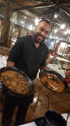Mushroom risotto to the left, very delicious. The right is seafood paella. at Can Sabata in Lloret De Mar