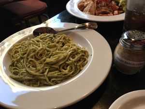 Pesto linguini, cashew Parmesan and vegan nachos at CyBelle's Front Room in San Francisco