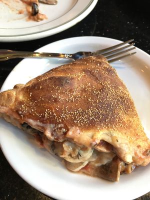 Half of the vegan Calzone (with house made cashew cheese mushroom olives and soy chicken. You can customize it. at CyBelle's Front Room in San Francisco