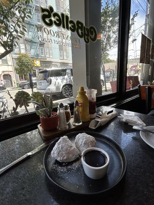 Vegan beignets with chocolate sauce   at CyBelle's Front Room in San Francisco