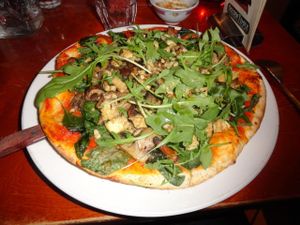 Vegan mushroom pizza with smoked tofu at Golden Temple in Amsterdam