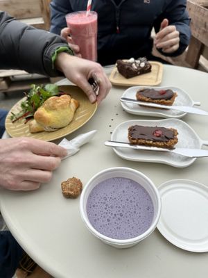 Blueberry pupshake and doggy treat in foreground   at Square Roots in Whitley Bay