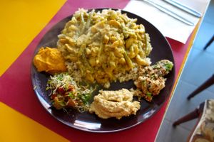 A steaming 'Veggie dish from the rainforest in Borneo', vegan.  at De Vliegende Schotel - The Flying Saucer in Amsterdam