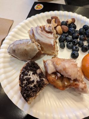 Blueberry, cinnamon roll, apple fritter, Oreo (from top left and clockwise) at Dottie's Donuts - Queen Village in Philadelphia