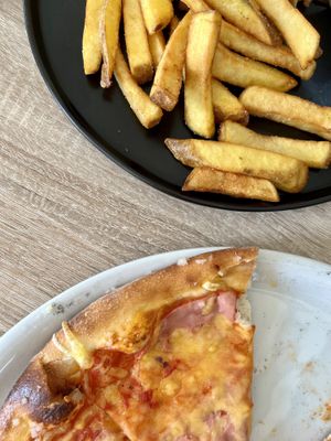 pizza and fries  at Pizza Boss & Boss Burger in Bratislava