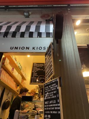 The shop with the owners and menu. at Union Kiosk in Melbourne