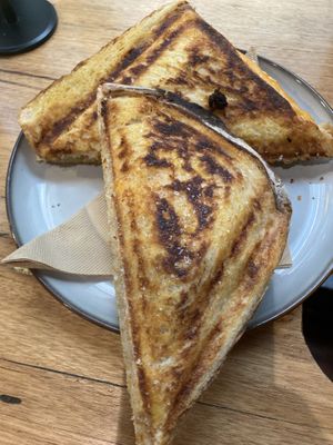 Tofu scramble jaffle - has ham and hollandaise sauce inside  at Union Kiosk in Melbourne