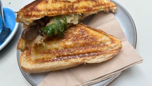 Rocket, béchamel sauce , hash brown, mushroom truffle butter  toastie. It’s a special and it is very special!   at Union Kiosk in Melbourne