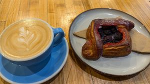 Beautiful latte art and a bunch of vegan pastries to choose from at Union Kiosk in Melbourne