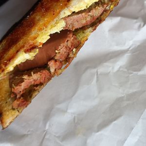 Tofu scramble, feta, sausage, pesto at Union Kiosk in Melbourne