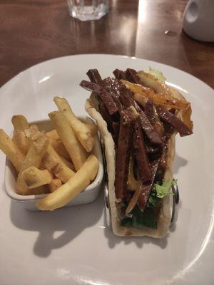 Seitan flatbread plus fries on side at The Hidden City Cafe in Londonderry