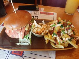 Garlic chicken burger with bacon and cheese and bacon topped fries! at The Caledonia in Liverpool