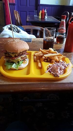 double cheeseburger with bacon and fries at The Caledonia in Liverpool