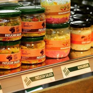 Mezes with olive oil and veggie salads in jars at Just Food Market in Ankara