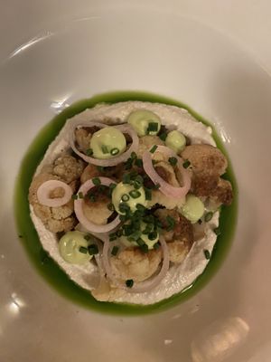 Roast cauliflower, chive oil, breadcrumbs, pickled onions, delish!  at De Waaghals in Amsterdam