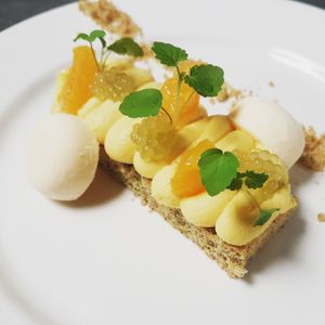 Dessert with orange custard, sablé breton and yoghurt icecream at De Waaghals in Amsterdam