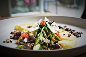 Main course with polenta, parmesan cheese and vegetables at De Waaghals in Amsterdam