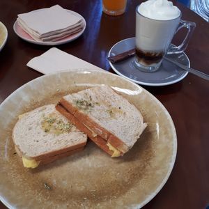 Tosta vegan de queijo e tomates + leite de soja e café at Terrarea in Matosinhos