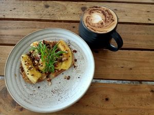 Oat milk latte and peanut butter toast with caramelised banana at The Factory Cafe in Koh Tao