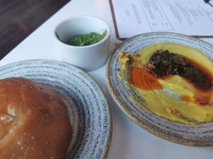 Focaccia, wild garlic/tropea onion confit/parsnip & curry leaves at The Omni Collective in South East London