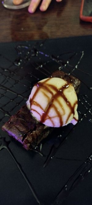 Vegan chocolate brownie and ice cream at Rock Garden in Torquay