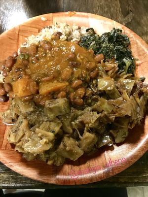 Jamaican Rice, coconut creamed spinach, steamed cabbage, jerk eggplant, and red beans. at Caribbean Connection in Lewisburg