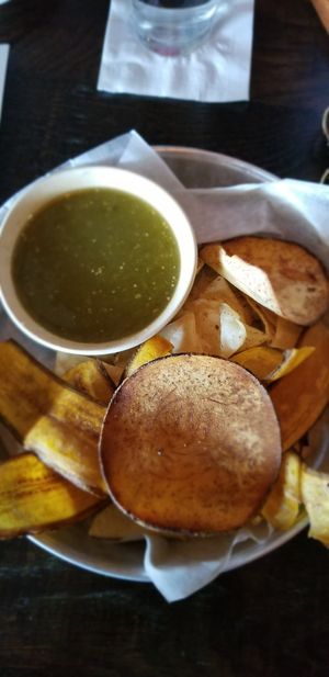 Salsa verde with plantain and taro chips at Bomba Tacos & Rum in Fairlawn