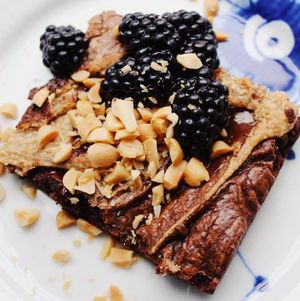 Brownie with peanutbutter frosting swirl and blackberries at Yellow Rose in Copenhagen