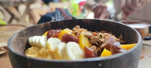 Dterm Pa-lang strength and power, smoothie bowl with peanut butter, dates, oats, banana, mango, coconut water & homemade granola at Bom Bowls in Pai