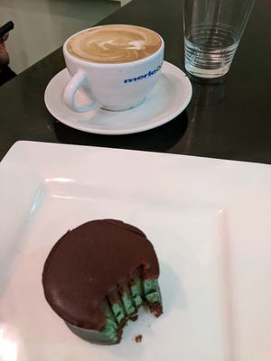 Choc Peppermint slice, and a flat white. at Orchid Vegetarian Cafe in Surfers Paradise