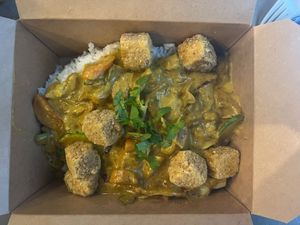 Buddha's Korma with Tofu- curry sauce sauteed with cabbage, carrot, onion, potato & zucchini served over jasmine rice at Foo Dog Curry Traders in Jacksonville