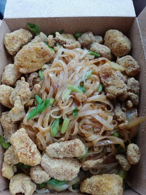 Kanpai Japanese Noodle dish with added popcorn chicken. Popcorn chicken is good. The dish itself is good but could use more flavoring/ sauce at Foo Dog Curry Traders in Jacksonville