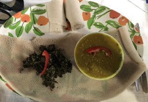 Pea-Dal with greens and a big injera (14.500 TZS)  at Spices and Herbs Restaurant in Arusha