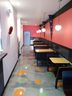 Interior seating near view of kitchen. at Boba Nosh in Novato