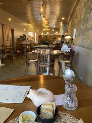 The starter and the main room (with no cats), there are a few tables outside at the entrance and also an outdoor room where the cats also have access.   at O Porto dos Gatos in Porto